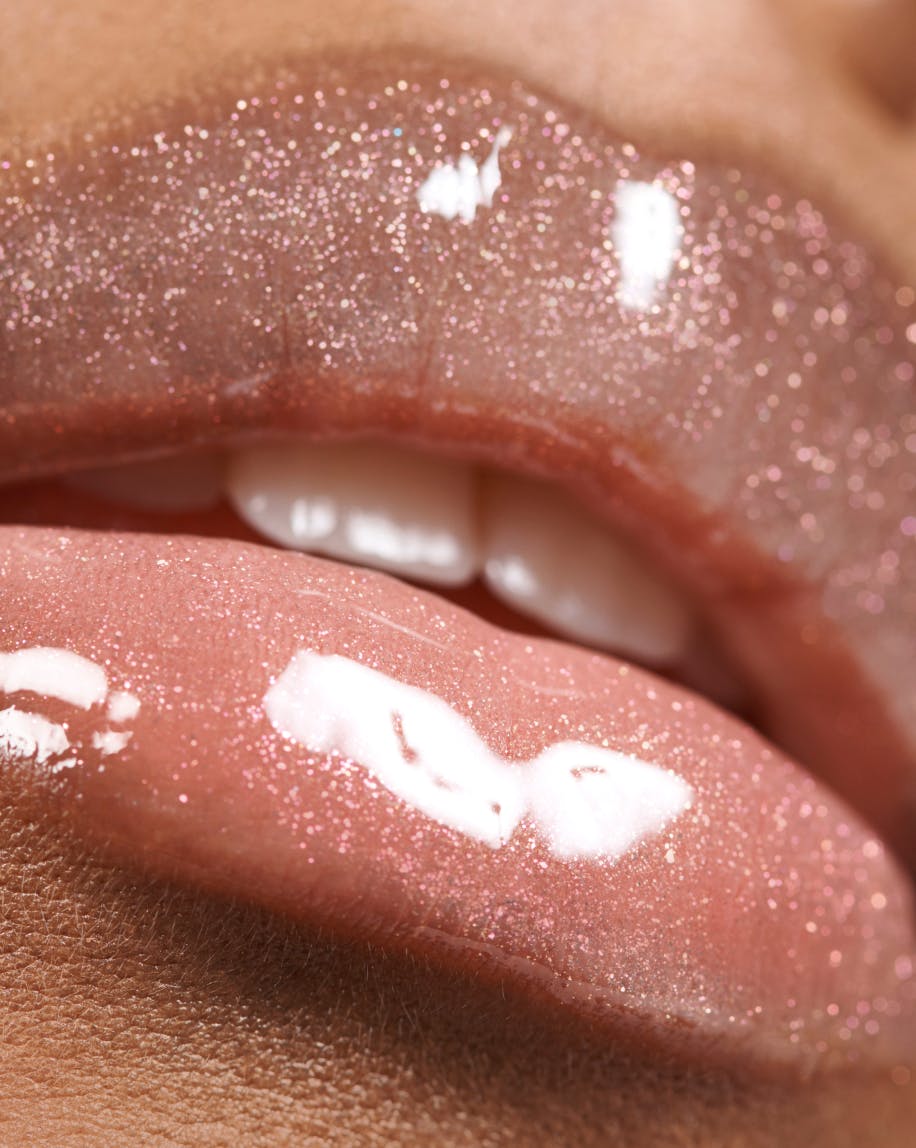 up close shot of clear lip gloss on lips